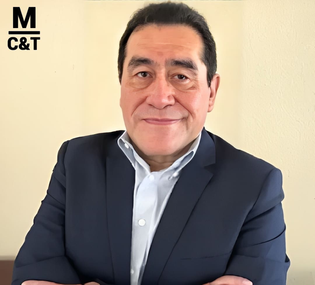 Man in suit with crossed arms.